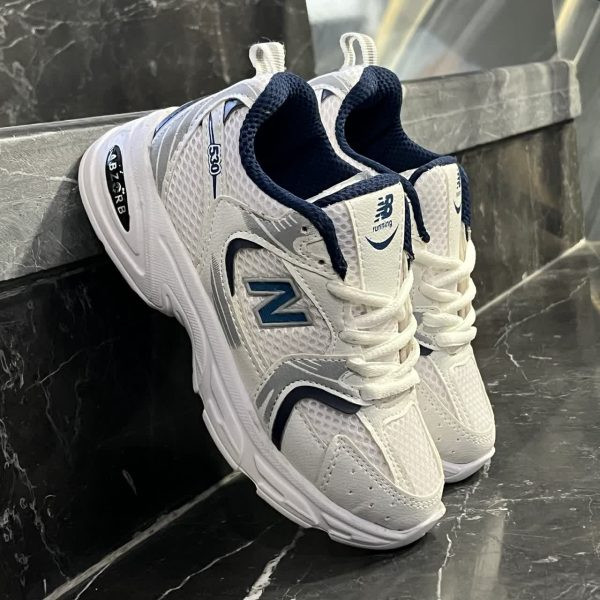 کتانی بچگانه نیوبالانس 530 سفید سرمه ای NEW BALANCE 530